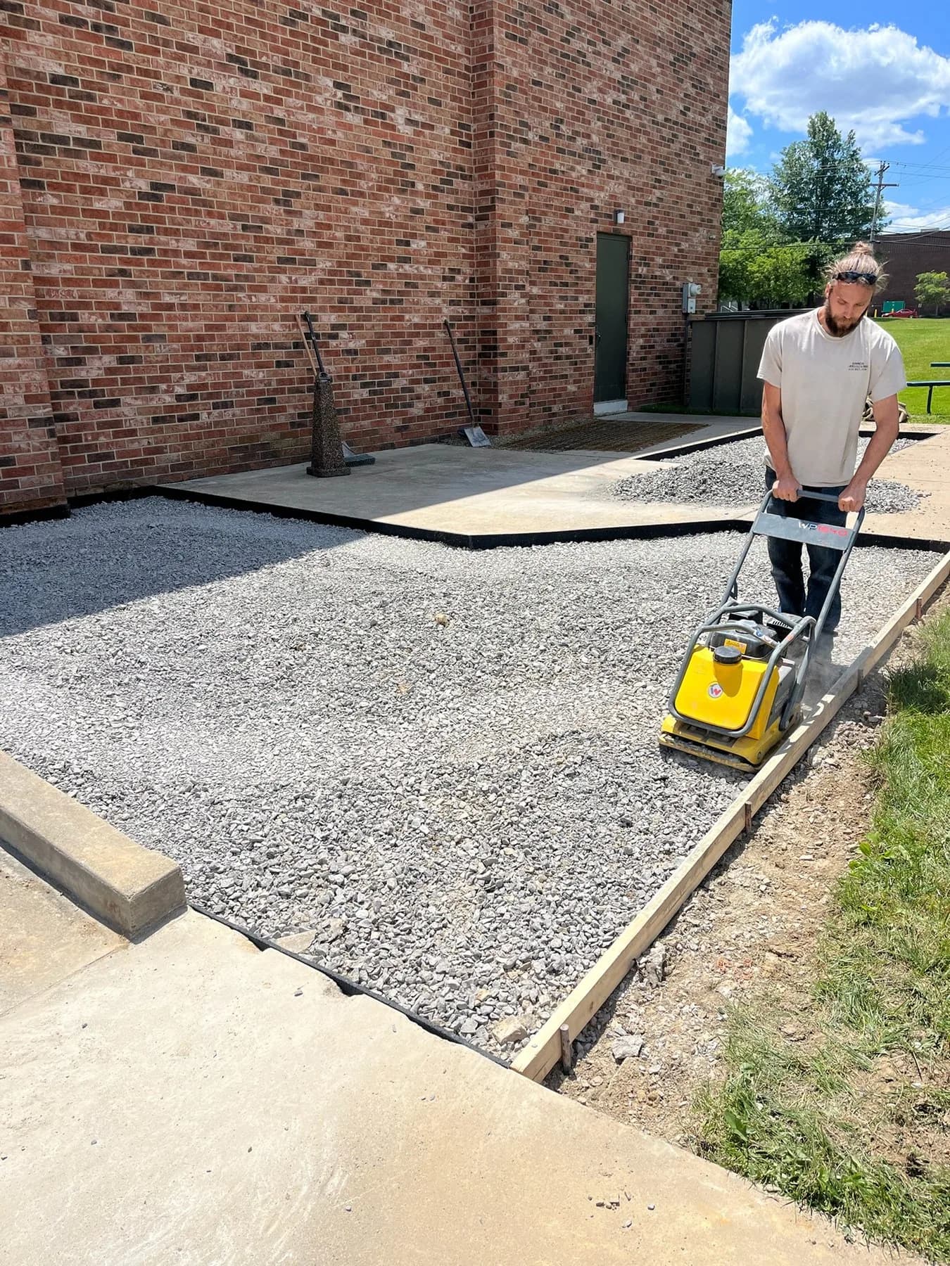 Compacting the stone base before a pour